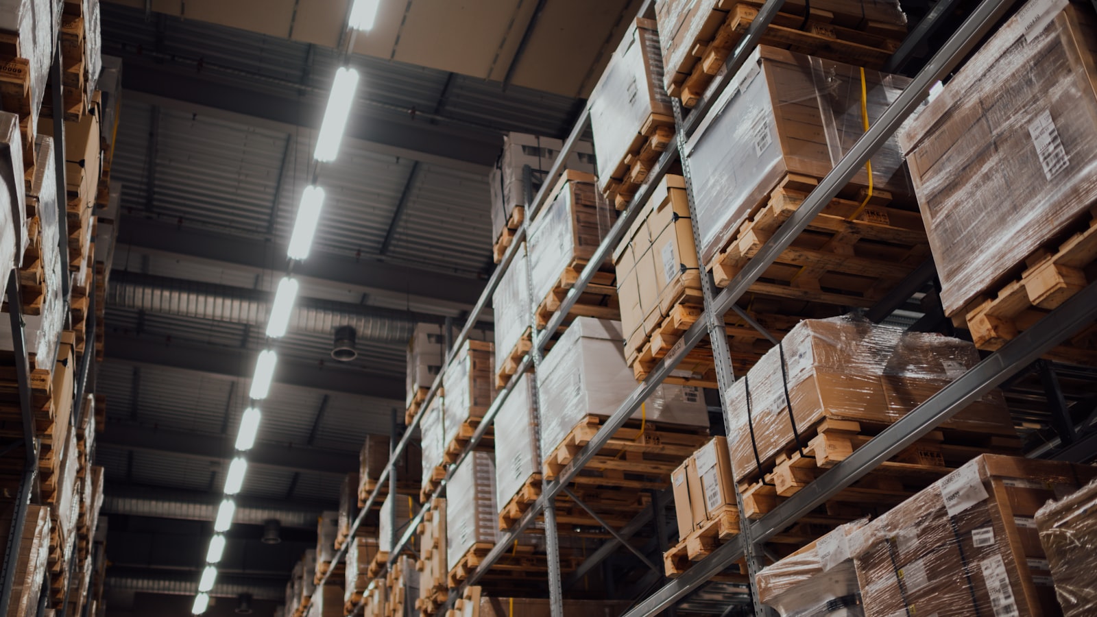 Wholesale warehouse with palletised goods on storage racks